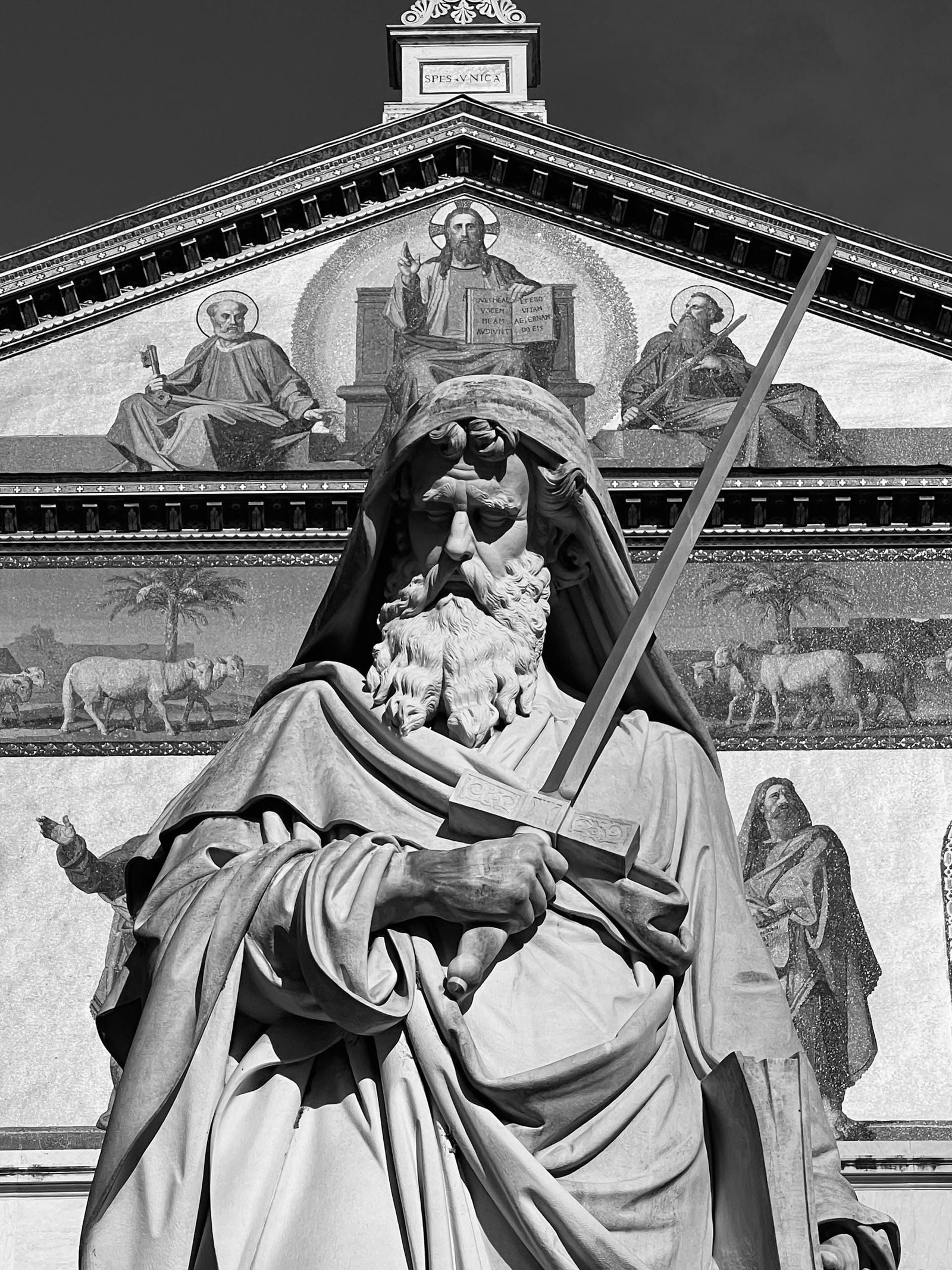 Black and white sculpture of St. Paul at Papal Basilica, Rome, Italy.